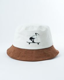 Skatepark scavenger bucket hat, white crown and brown brim with skateboard bird logo