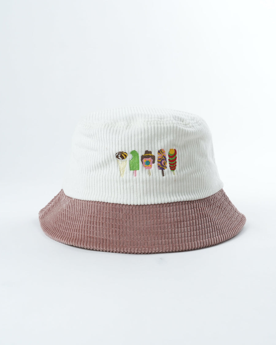 Two-tone bucket hat with white ribbed crown, mauve brim, and animal embroidery