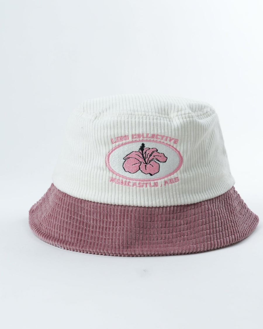 Two-tone bucket hat in cream and mauve with embroidered flower patch