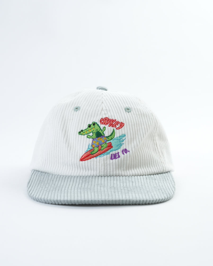 Light gray corduroy hat with embroidered gator surfing graphic on the front.
