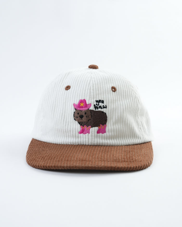 Cream-and-brown snapback cap with bear graphic embroidery on front