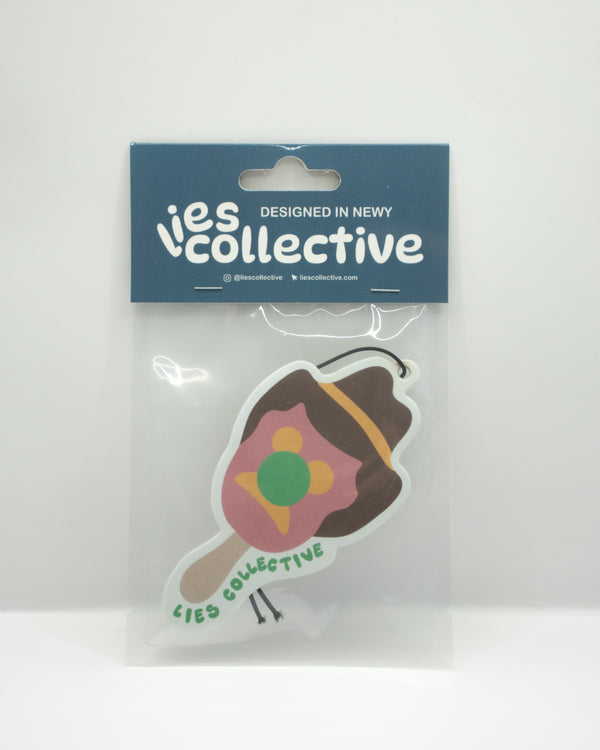Brown cowboy boot air freshener with colorful bubble graphic, in clear package