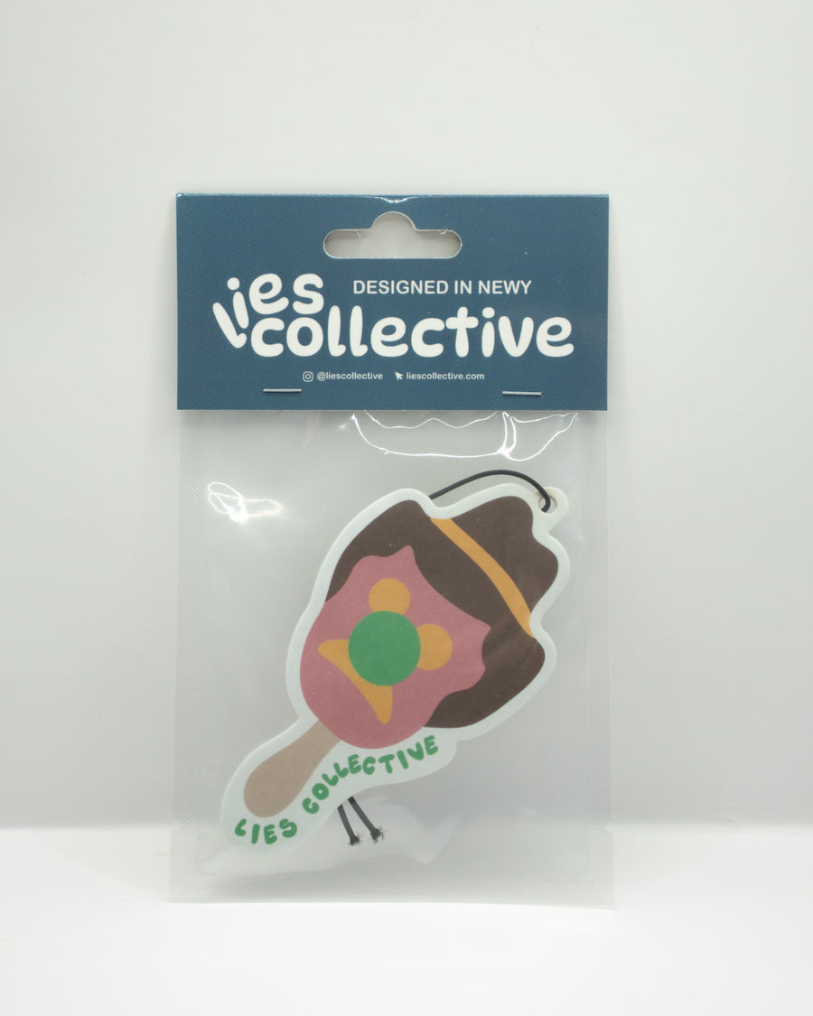 Brown cowboy boot air freshener with colorful bubble graphic, in clear package