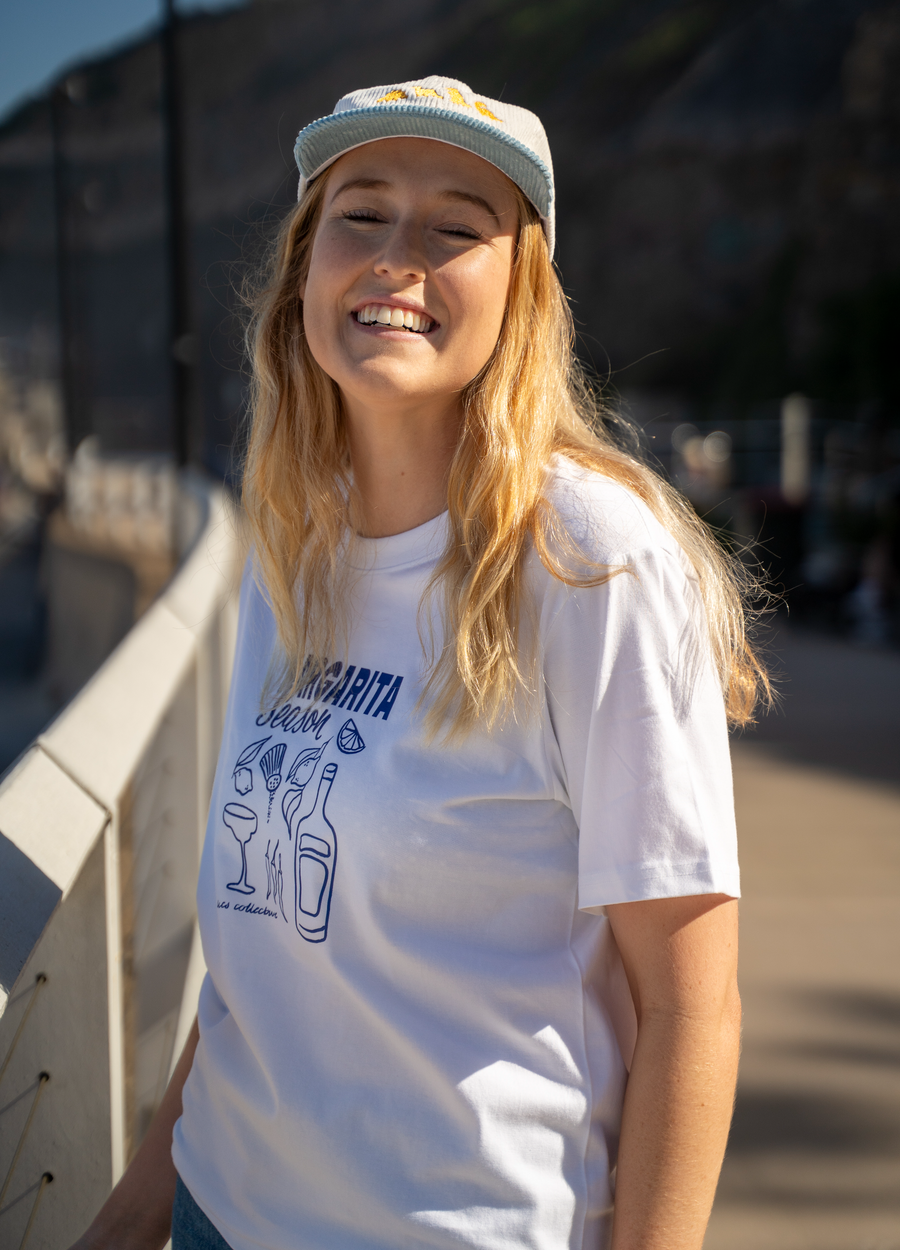 White crew-neck graphic Margarita Season tee with blue cocktail line-art front